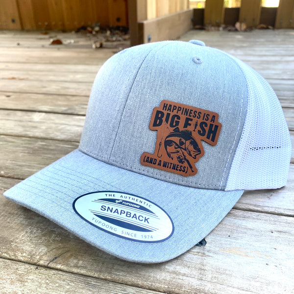 Happiness is a Big FIsh and a Witness Leatherette hat patch on a 6606 Classic Trucker Hat